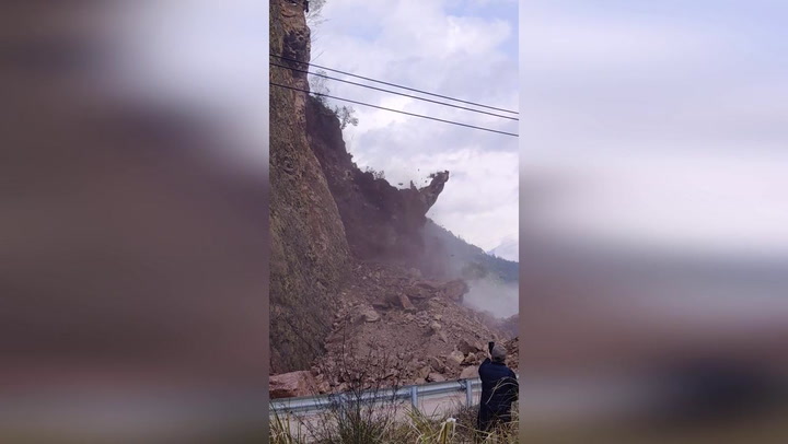 Terrifying landslide buries highway as motorists miraculously escape