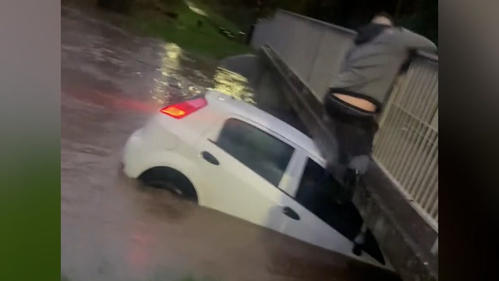 Hero saves three-year-old and driver trapped in sinking car during Storm Henk floods