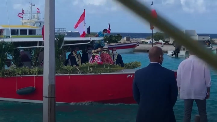 Macron sinks under flower garlands in French Polynesia_m197655.mp4