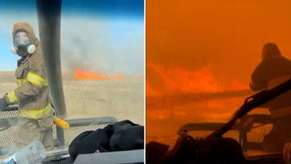 Watch: Firefighters drive through largest blaze in Texas history