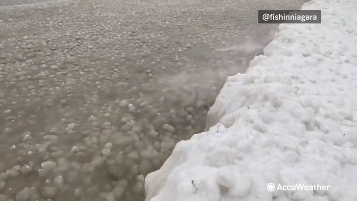 Video: Balls of ice wash ashore at lake in Canada as temperature