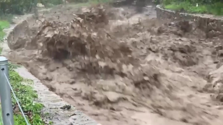 Deluge of water bursts banks of creek during California storm