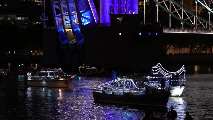 Night-time flotilla marks Queen's death illuminating river Thames