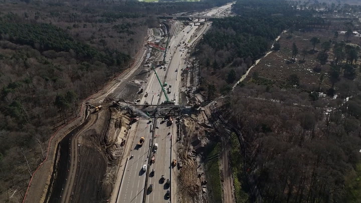 Closed M25 drone footage captures workers demolishing bridge