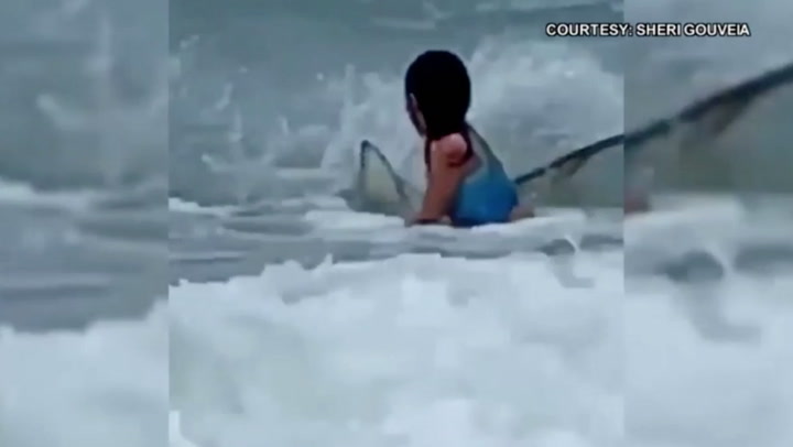 Mother shares terrifying video of shark circling her toddler at Hawaii beach