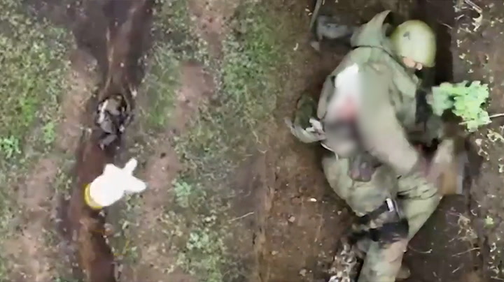 Russian Soldier Catches And Throws Bomb Dropped By Ukrainian Drone