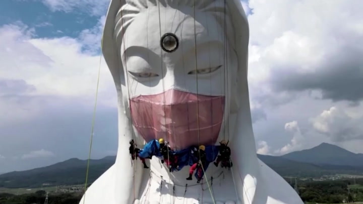 Giant Buddhist goddess statue in Japan gets face mask to pray for end of Covid