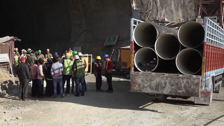 Rescuers work to save 40 workers trapped under collapsed tunnel in India