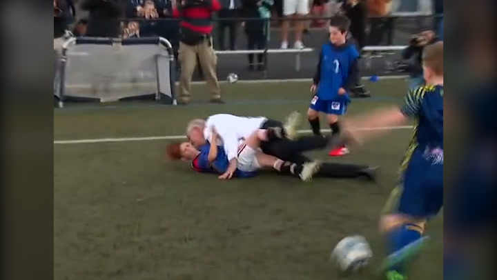Australian PM Scott Morrison flattens schoolboy during football match