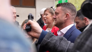 Tommy Robinson arrives at court accompanied by Katie Hopkins