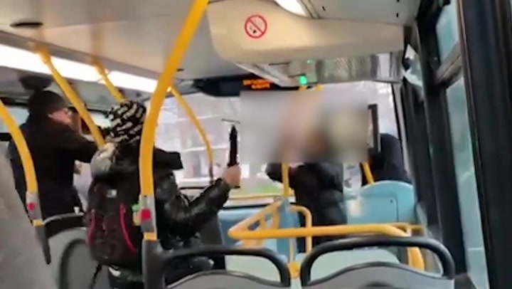 Teenagers fight with knife and sword on south London bus