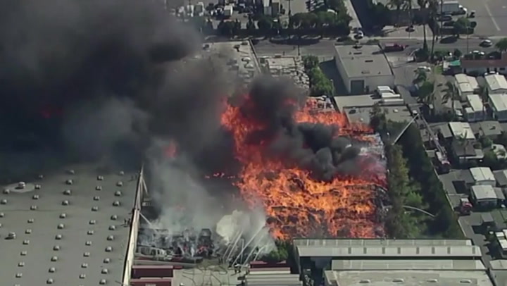 Massive pallet fire burns on California industrial site