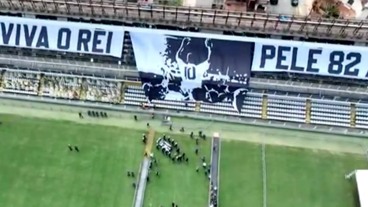Pele's coffin carried out of Santos stadium by soldiers as funeral gets underway