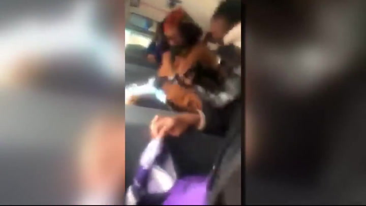 Small child physically restrained by staff on Detroit school bus