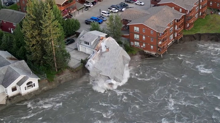 Alaska house crashes into river as glacier flood batterS riverbank