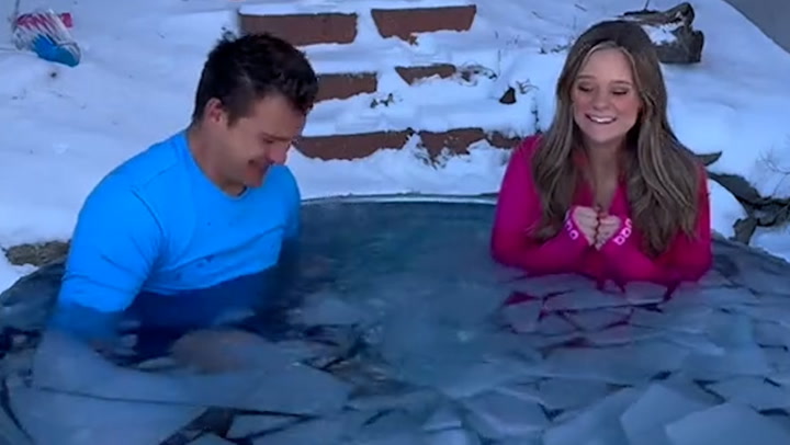 Couple jump into ice bath for baby's gender reveal