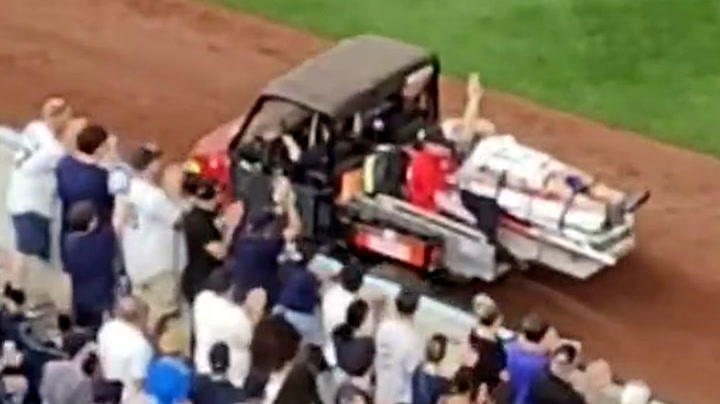 Yankees cameraman stretchered off pitch after being hit in head by baseball