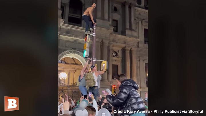 Eagles Fans “Surf” Crowd, Climb GREASED Poles in Celebration Chaos