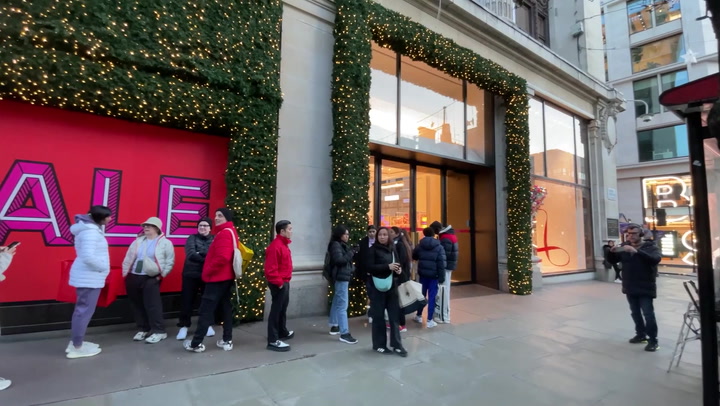 Shoppers queue outside Selfridges on Oxford Street for Boxing Day sales