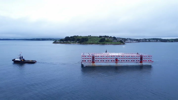 Three-storey barge expected to house migrants arrives at Falmouth