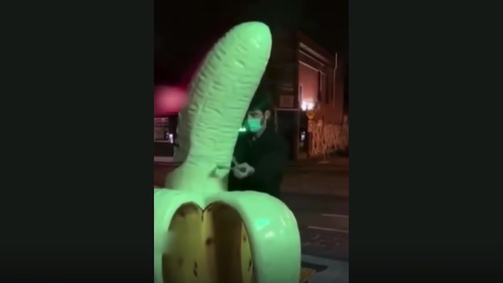 Man takes hacksaw to giant 6ft-tall banana 