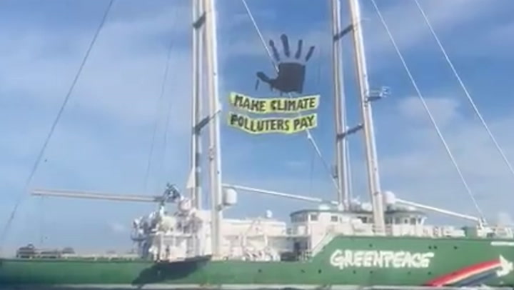 Greenpeace activists block Shell port to 'make climate polluters pay'