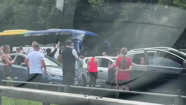 Band serenades stranded motorists after fire halted traffic on M6 near Preston