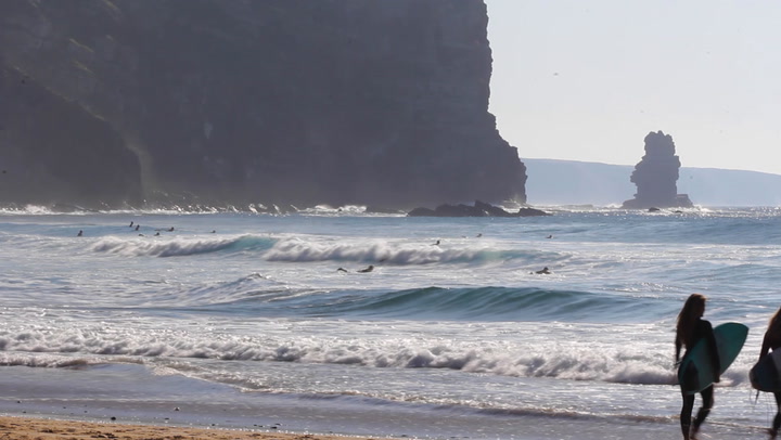 Surfers on Arrifana Beach, Praia da Arrifana 