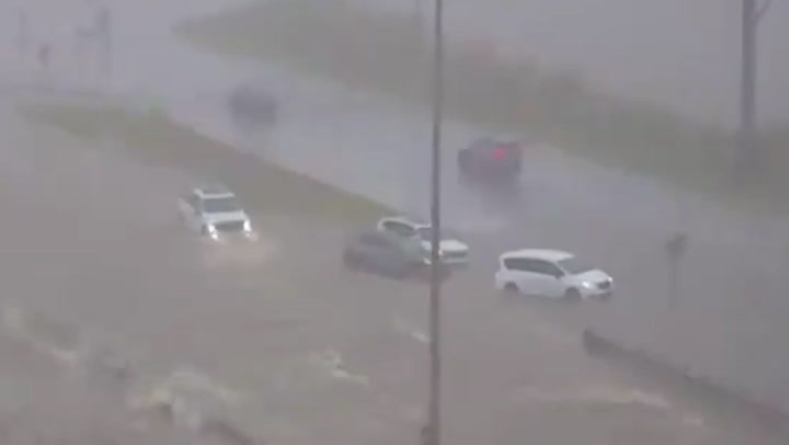 Cars submerged by flash flood water on Alabama highway