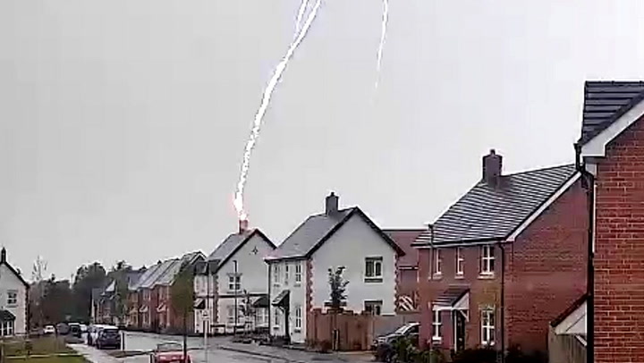 Moment lightning bolt strikes couple's home in Oxfordshire and destroys roof