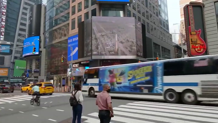 New Yorkers ignore Jeff Bezos's rocket launch on Times Square screen
