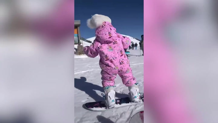 Snowboarding toddler who got her first board at just three weeks old shows off skills