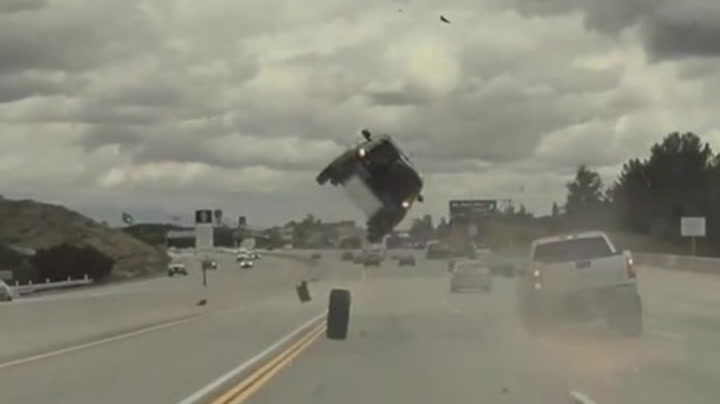 Loose tyre shoots off truck and sends car flying into air