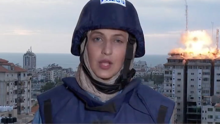 Moment Israel strikes Gaza tower block as reporter is live on-air