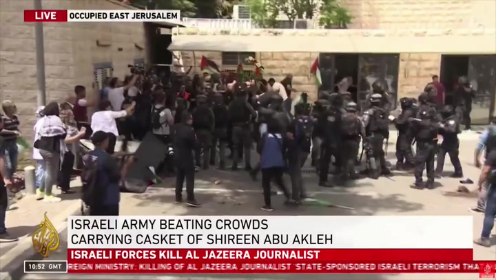 Israeli forces attack mourners carrying casket of dead Al Jazeera journalist