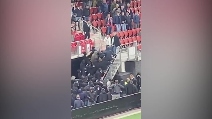 Chaos erupts as AZ Alkmaar fans invade West Ham's family section in stadium after 3-1 loss