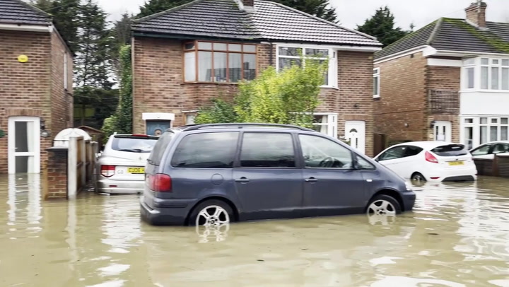 Residents wade through flooded Loughborough road after Storm Henk brings heavy rain