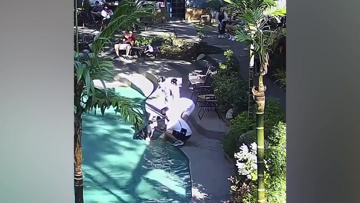 Heroic waitress plunges into pool to rescue drowning boy