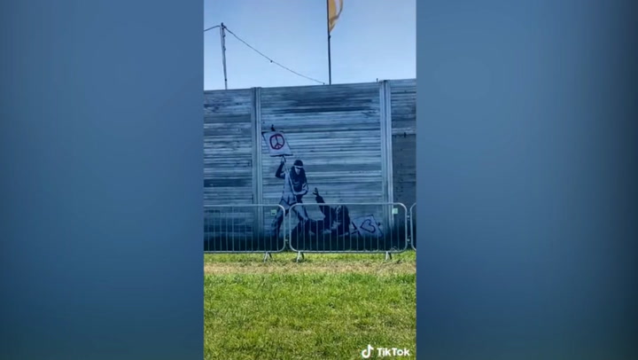 ‘Original’ 2010 Banksy appears on Glastonbury fence