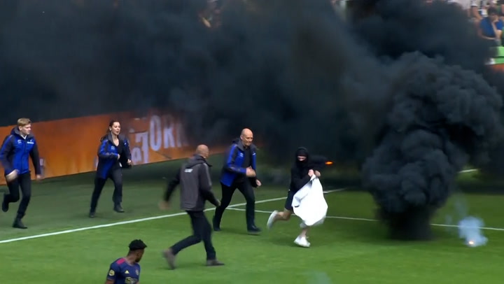Groningen fans throw smoke bombs and invade pitch in protest of first relegation in 25 years