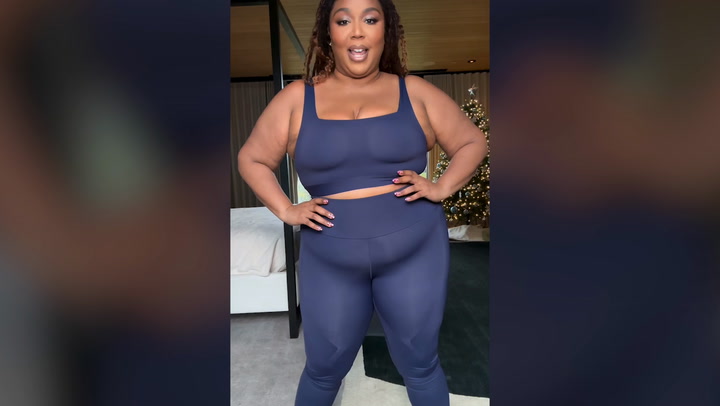 Lizzo shows off her new slimmer figure in low-cut dress as fans