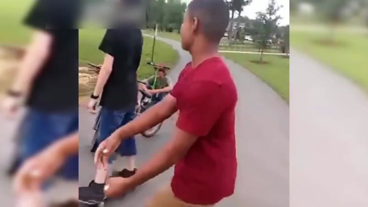 Thug uses Brass knuckles to tackle 12 year old to floor
