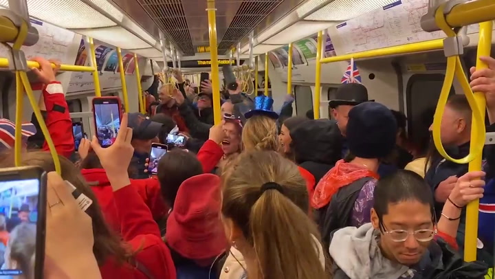 Royal fans sing Katy Perry songs on packed Tube after coronation