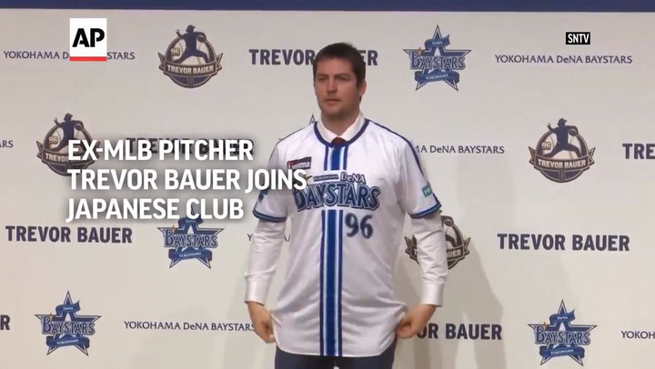 Trevor Bauer, shunned by MLB, introduced by Japanese team