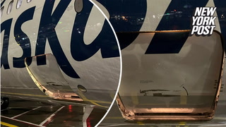 Alaska Airlines flight carrying pets arrives with cargo door open