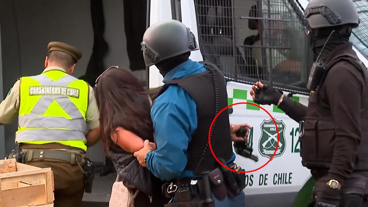 Moment woman takes gun from guard and shoots, injuring three in Chile