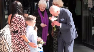 Watch: King and Queen receive flowers from children at cancer centre