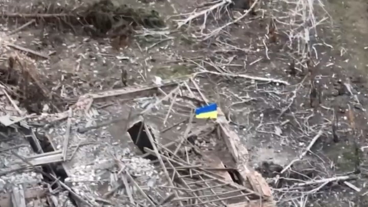 Ukraine flag flies on building after soldiers capture village of Robotyne from Russia