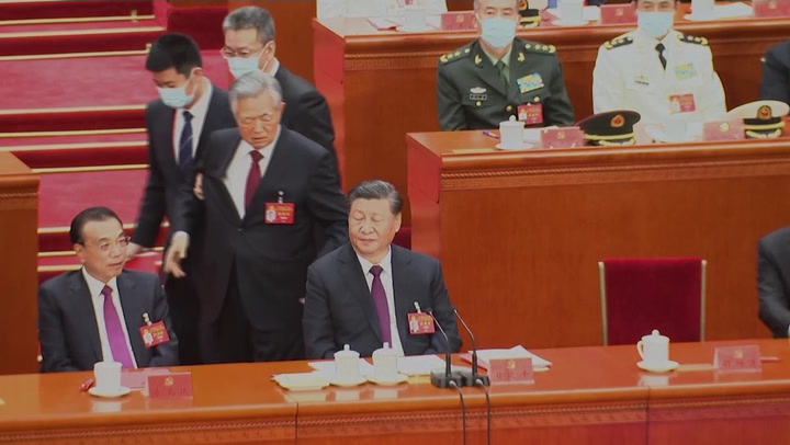 Former Chinese president Hu Jintao unexpectedly led out of congress