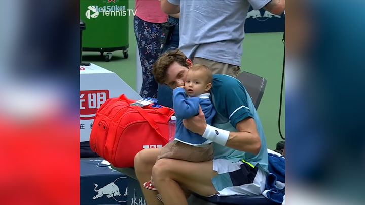 Tennis player's adorable son toddles onto court